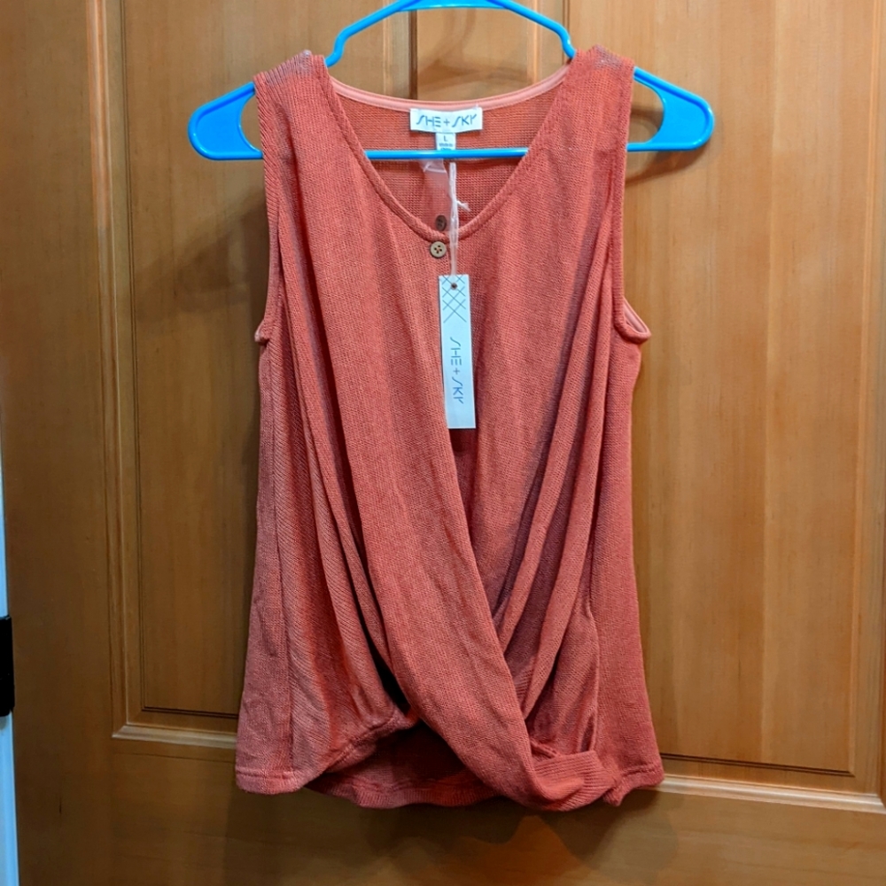 She +Sky L sleeveless light weight sweater in coral.